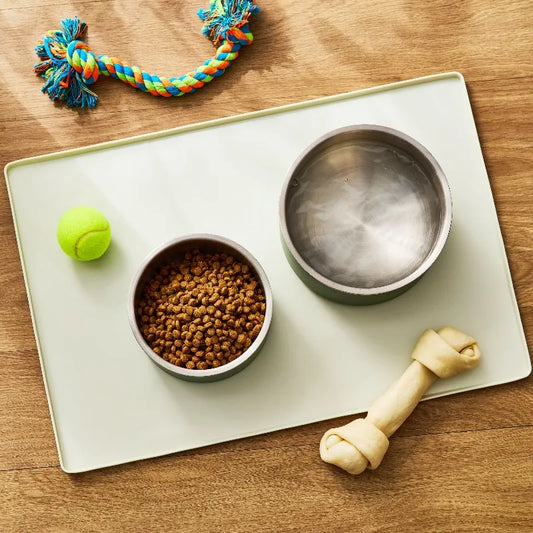 Large Silicone Pet Feeding Mat, Beige, 23.5" x 16" Raised edge design helps contain food and water.